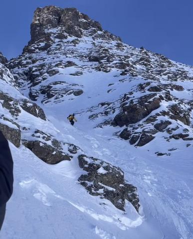 Silverton Mountain Guide Calvin Davenport drops in the chute photo by Silverton Mountain