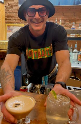 The Den’s bartender Charlie was churning out cocktails for Friday night’s live music event photo by DeAnne Gallegos