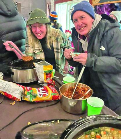 Taste testing at the Chili Cook Off. Photo by Wendy Polly