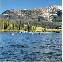 Silverton locals and Ruger Dog take an evening paddle board session after work up at Molas Lake. Photo credit DeAnne Gallegos