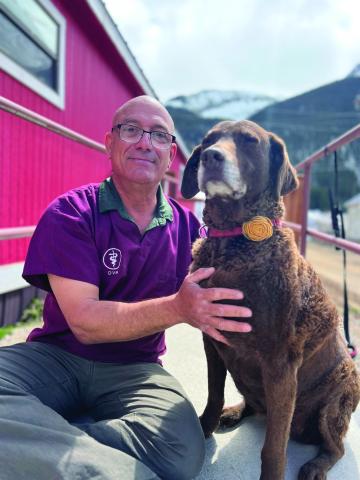 Dr Joe Alaimo with Diesel Dog at Senior Center. Photo credit DeAnne Gallegos