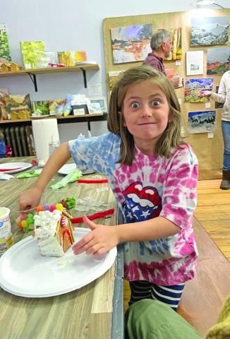 Gingerbread house decorating fun. Photo by 9318 Collective