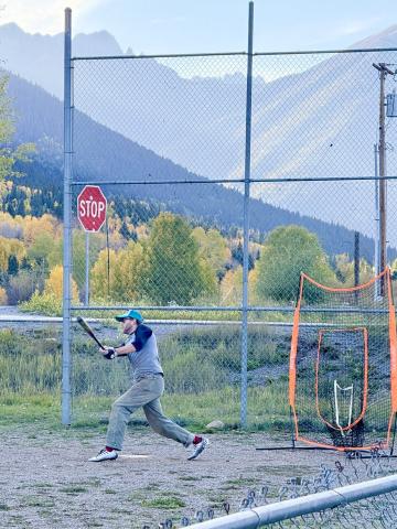 Chris Brosh knocks the ball out of the park on Sunday night photo by DeAnne Gallegos
