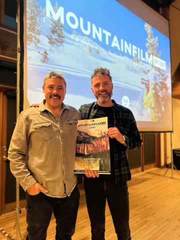 Mountain Film 2025 Emcee Rory Cowie and Mountain Film Organizer Brenden Goetz