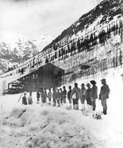 Rescue workers involved in cleanup of the March 17, 1906 avalanche at the Shenandoah Mine on King Solomon Mountain, bringing corpses down from that disaster by way of Cunningham Gulch