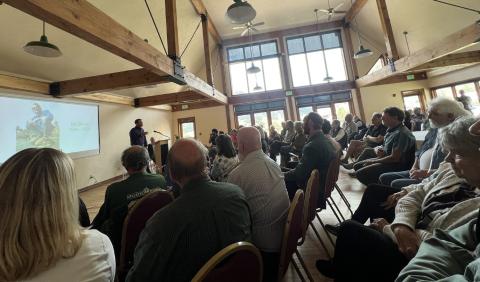 Bill Simon’s memorial last Thursday at Kendall Mountain Community Center was packed with about 100 people in attendance. Photo credit DeAnne Gallegos