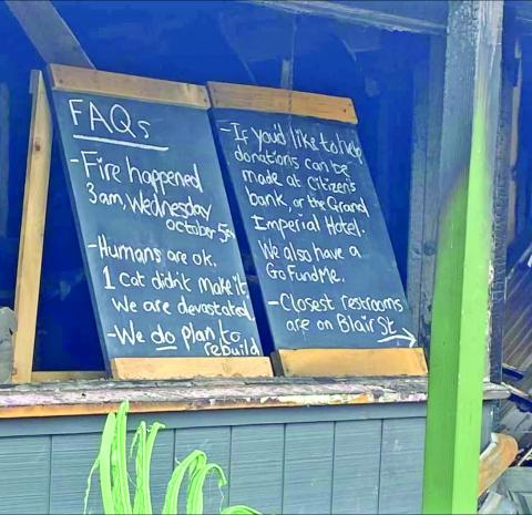 Signs in front of the destroyed Silverton Square Café. Photo Credit: Silverton Area Chamber of Commerce