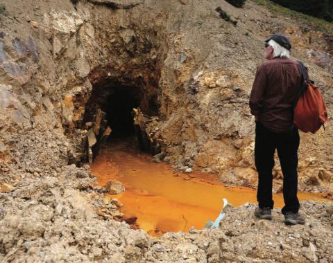 San Juan County Commissioner Pete McKay examines the Gold King 7 portal above Gladstone on Monday Aug 10 2015 photo by Farmington Times