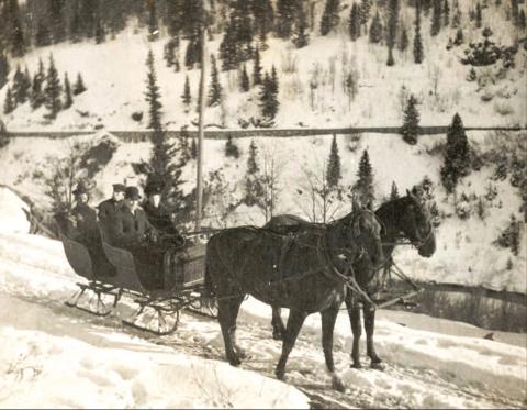 Enjoying a sleigh ride behind a two-horse team on Christmas Day, 1906, were, from left, Alice Dyson, James Dyson, Dan McNaughton and Edith Dyson McNaughton (she and Dan were married Oct. 19, 1906). The photo was probably taken on the Howardsville road above Arastra Gulch, based on the flume in the background. Photo Courtesy of the Edith Dyson McNaughton Archive