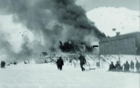 FIRE AT THE SUNNYSIDE. Fire engulfs buildings at the Sunnyside Mine on April 19, 1919. The boarding house is on the right. San Juan County Historical Society photos