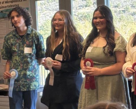 Brynn Hamm is in middle of the three students who competed photo by Silverton School