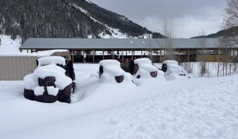 Photo credit Scott Fetchenhier Snow on the antique trucks near the train depot.