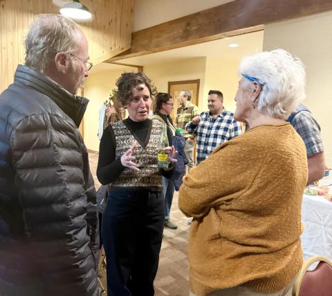 Elizabeth Stuffings talks with San Juan County Comissioner Scott Fetchenhier and community member Sue Morris