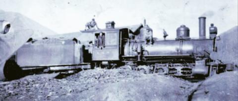 The Silverton Northern Railroad locomotive No. 3 in 1918, with the tender standing on the siding south of the Silverton Northern machine shop, facing the northeast. In the cab is William Pollman (1899-1970). John Pollman is on top of the cab. He would have been 13 in 1918. An unidentified boy is in the cab and an unidentified man is on the boiler. Photo courtesy of San Juan County Historical Society
