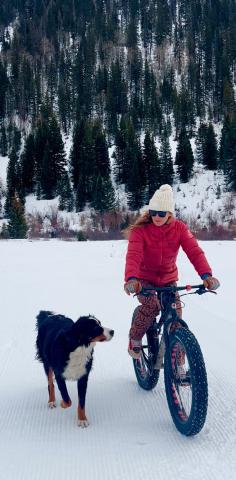Kimmy Grant and her dog Oliver taking their daily fatbike ride on groomed trails. Photo credit DeAnne Gallegos