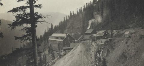 The Gold King Mine and boarding house in 1906 at left, tram buildings, generator unit and dump in center. Despite marginal notation, this picture would have been taken after 1910 because of the addition of the new descending covered walkway between the tram buildings and the boarding house. San Juan County Historical Society photo