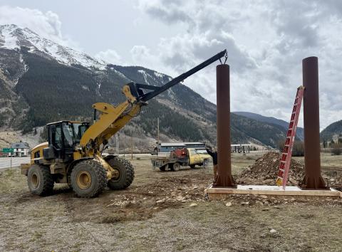 The Town of Silverton Public Works crew place and bolt down the new entryway sign poles on Monday photo by John Zarkis