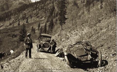 The wreckage of Will Ennis’ automobile on the roadway above Chattanooga. Two men are on the roadway. The man at right is Fred Patterson. The Ennis vehicle crashed on Wednesday, Oct. 5, 1921 Photo courtesy of San Juan County Historical Society