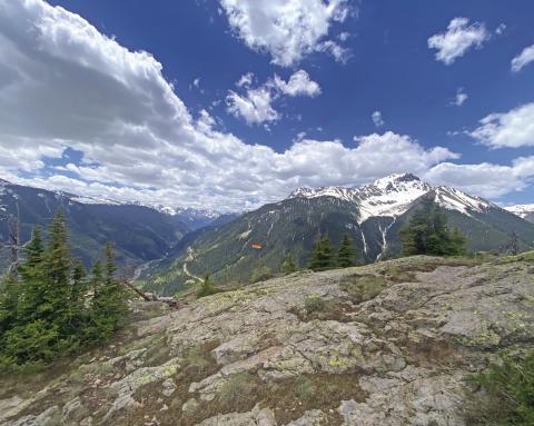 A pride flag on a summit above town. Photo by Blair Tice