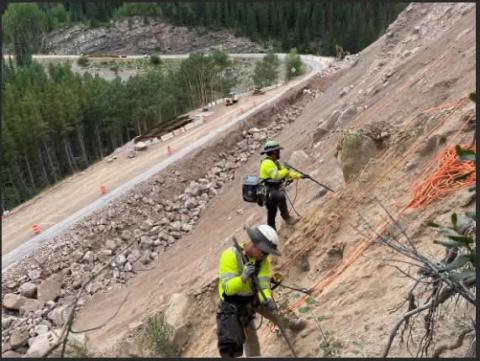 Crews working on rock wall. Photo by CDOT