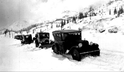 Photo courtesy San Juan County Historical Society The top of Red Mountain Pass, showing seven vehicles, one of which has turned around in the snow on June 5, 1924.