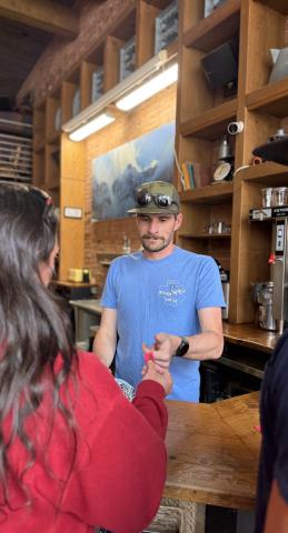 Ryan McClure takes drink tickets at the MMS Friday night happy hour at Coffee Bear photo by DeAnne Gallegos