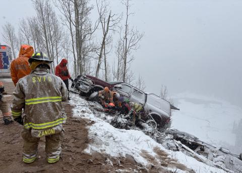 A photo of the vehicle and camper over the edge on highway 550. Photo credit Silverton Medical Resuce