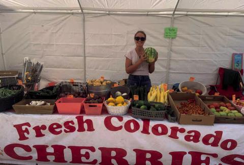 Raelen Barr sells fresh produce at the Columbine Roadhouse M-F, 10-6pm Photo by Raelen Barr