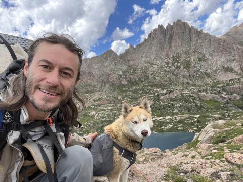 Brady Snow and is Dog Katana on Jagged Mountain in the Needle Mountains. Photo by Brady Snow