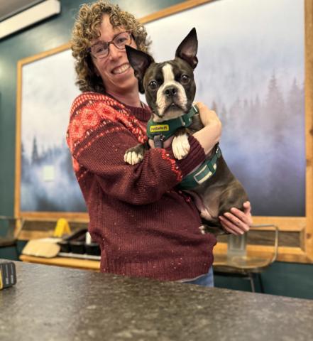 photo by DeAnne Gallegos Gina Rosato of Timberline Trading and her shop dog DOC