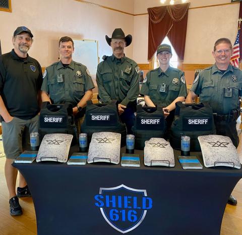 L-R: Jake Skifstad with Shield 616, SJC Sheriff Deputies Adam Clifton, Dean Mize, Meah Mordecai, and San Juan County Sheriff Steve Lowrance. Photo by Willy Tookey