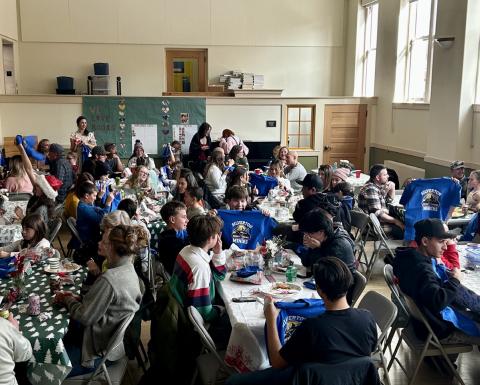 Students receive their school T -shirts at school holiday luncheon photo by Dr. Yvonne Naughton