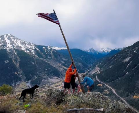  Thomas Moore On Memorial Day three locals Thomas Moore, Reid Kalmus, and Joe Lindberg put the flag and tree pole back up on Anvil Mountain overlooking Silverton.