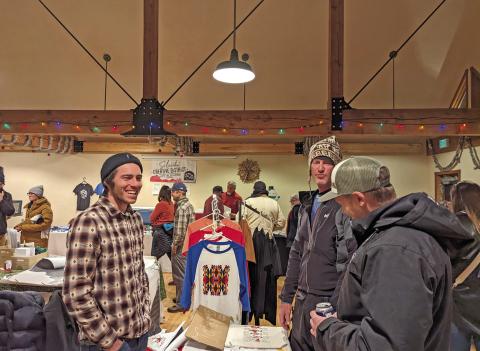 Photo credit Silverton Creative District Julian Hood with his screen-printed tees at the Mistletoe Market.