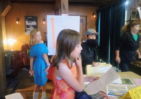 Silverton School kids Maxine and Anyela help the Silverton Family Learning Center present information at the Coffee Bear open house Photo by Megan Brosh