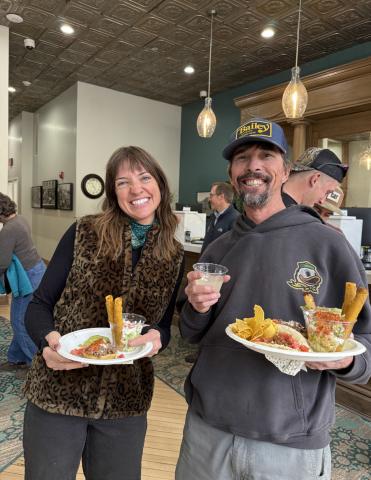 Holly Huebner and Paul Joyce enjoy local food truck High Altitude's tacos at the Citizens State Bank grand reopening party photo by DeAnne Gallegos