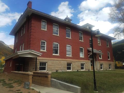 This photograph from the south shows the completed work on the building including the new handicap entrance and ramp on the Bluff Street end of the building.