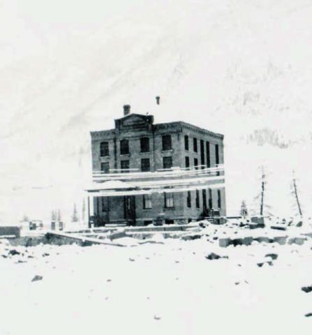 The San Juan County Jail in 1906. Snow covered telephone wires run along Greene Street. Photo: From the San Juan County Historical Society archives.