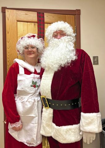 Mr. and Mrs. Claus were in attendance at the annual holiday potluck. Photo credit DeAnne Gallegos