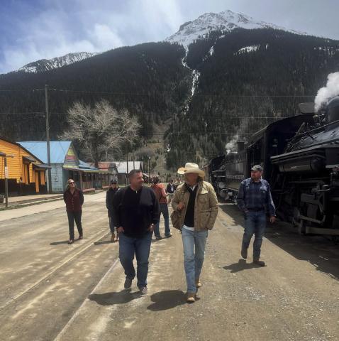 Celebrity Kevin Costner and local Jim Harper in front of the train.