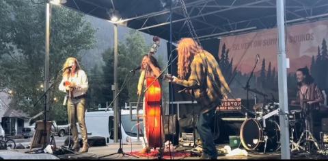 Sweet Lillies play in the rain during Silverton Summer Sounds. Photo credit DeAnne Gallegos