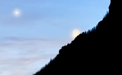 The crescent moon coming out of a new moon this week, peaking over Anvil mountain with a bright star nearby photo by DeAnne Gallegos