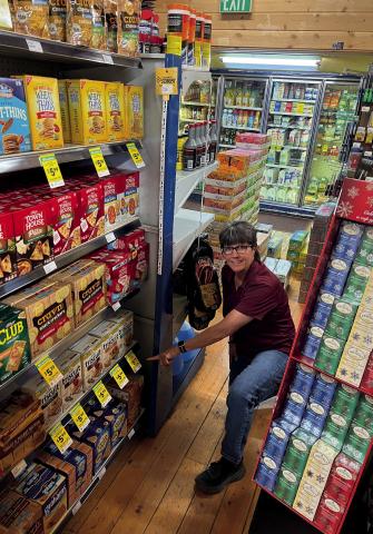 Charlie Monsalve shows off the new customer appreciation program. Photo Credit DeAnne Gallegos