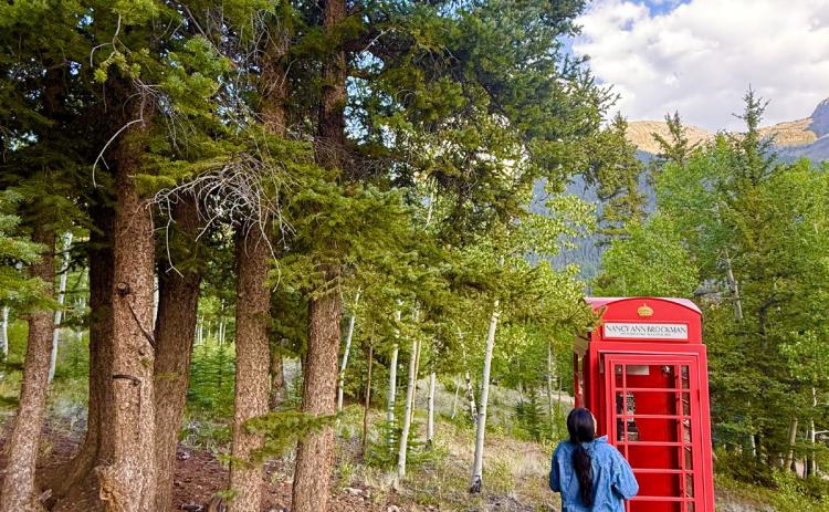 It has been one year since Silverton Local Nancy Brockman passed away. Angelina Noble paid her respect at the now well-known Windphone. People have come from all over to use the Windphone to call their loved ones who have passed. Photo by DeAnne Gallegos