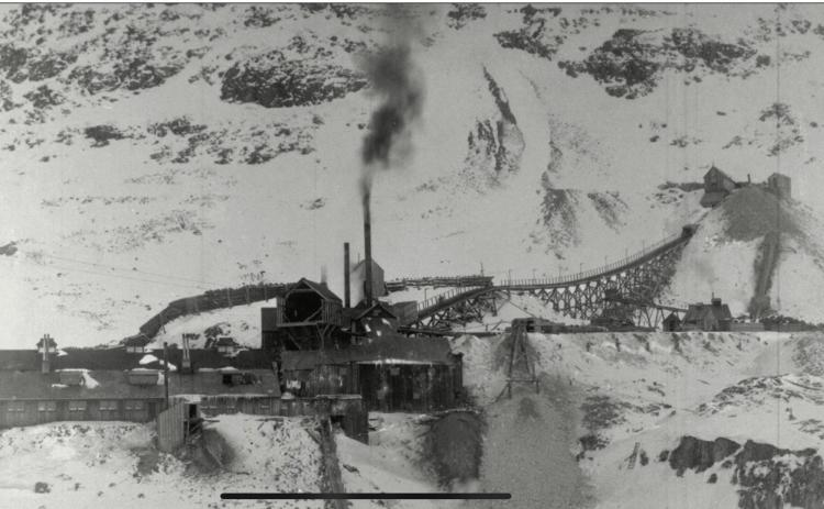 Iowa Mine structures at Silver Lake in 1898, looking toward the west, showing the operation at peak development, including tram station and surface tram trestle. Photo: San Juan County Historical Society