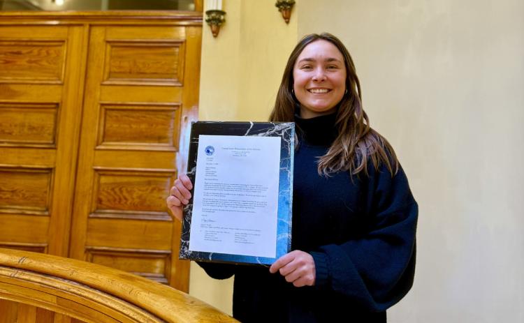 Town of SIlverton's Community Development Director Lucy Mulvihill shows off the letter from the Department of the Interior announcing Town of Silverton's CLG photo by DeAnne Gallegos
