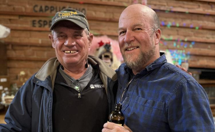 Longtime local Terry Morris and newly appointed Town Councilman Dr. David Brown enjoying live music at The Den photo by DeAnne Gallegos