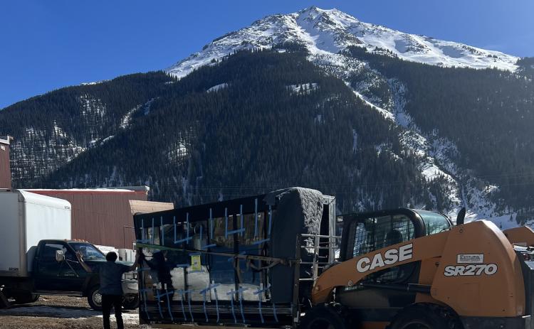 The delivery of the new grocery cases thankfully happened on a warm sunny winter day. Photo credit Darlene Watson