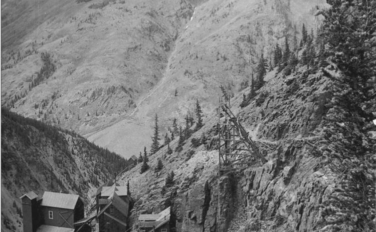 The Old Hundred Mine in 1906, from above and southeast of the improvements. Shows all improvements in place at the height of operations, including boarding house, tram buildings and portal and entry structures. View is from higher on Galena Mountain in a northwesterly direction, toward Brendel Gulch on Macomber Peak San Juan County Historical Society photo