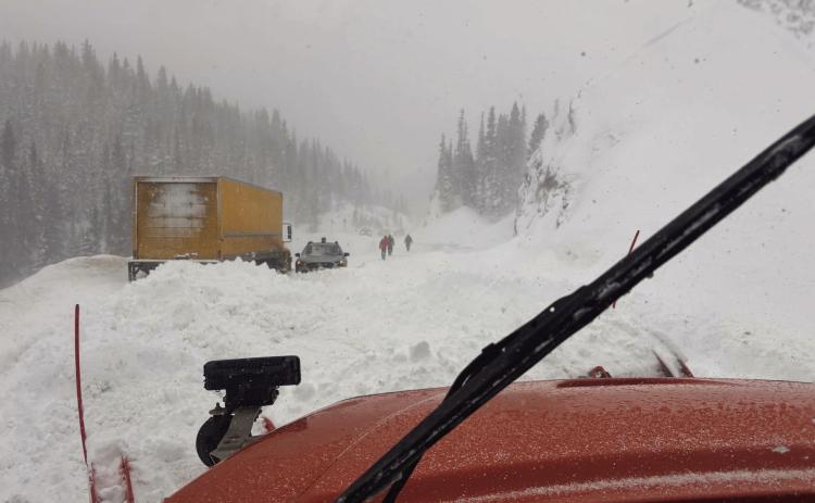 A natural slide occurred, striking one box truck and trapping a smaller vehicle that attempted to drive through the slide. Photo credit CDOT